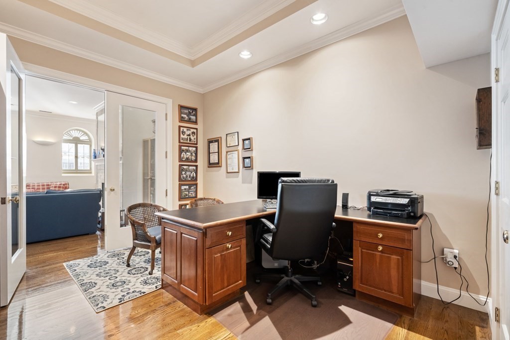 49 Rawson Road, Unit 49 Brookline, MA 02445 - Photo 13 of 42 a view of a workspace with furniture and a window