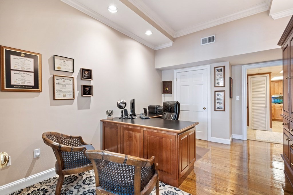 49 Rawson Road, Unit 49 Brookline, MA 02445 - Photo 14 of 42 a living room with furniture and wooden floor