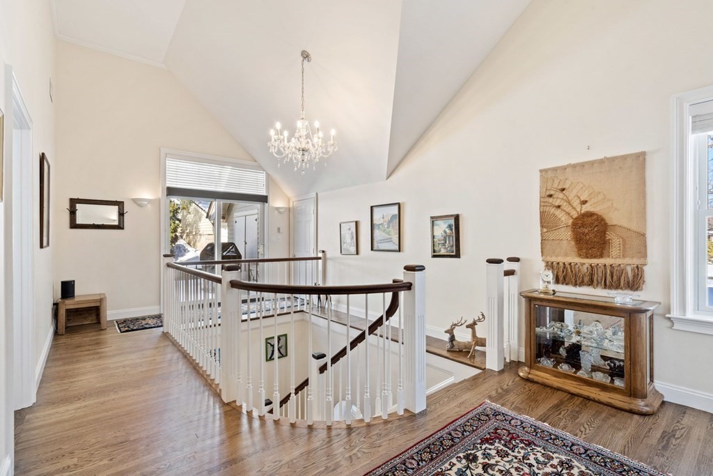 49 Rawson Road, Unit 49 Brookline, MA 02445 - Photo 17 of 42 a view of a livingroom with wooden floor and furniture