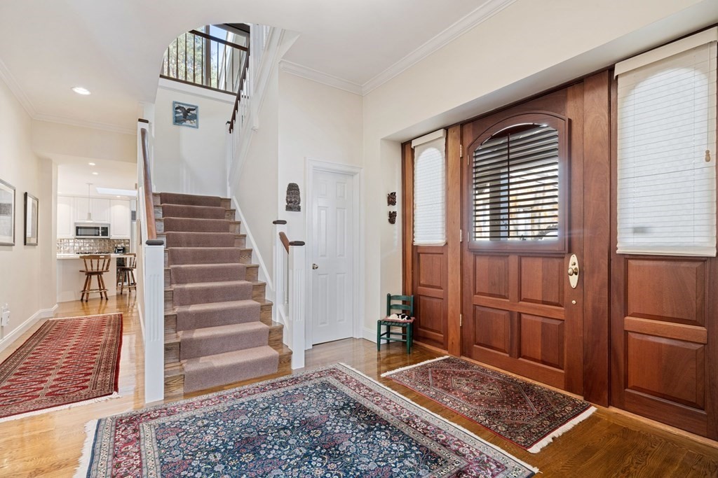 49 Rawson Road, Unit 49 Brookline, MA 02445 - Photo 3 of 42 a view of entryway with furniture and wooden floor