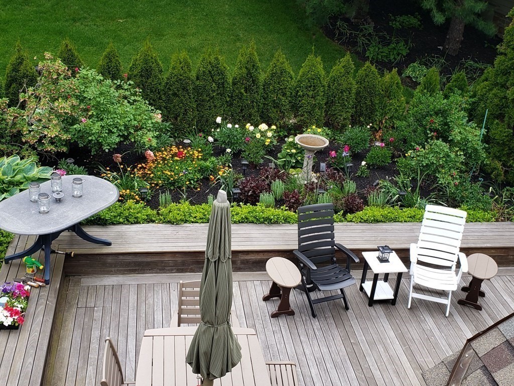 49 Rawson Road, Unit 49 Brookline, MA 02445 - Photo 31 of 42 a view of table and chairs in patio