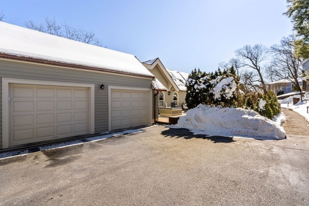 49 Rawson Road, Unit 49 Brookline, MA 02445 - Photo 33 of 42 a view of a house with a yard and garage