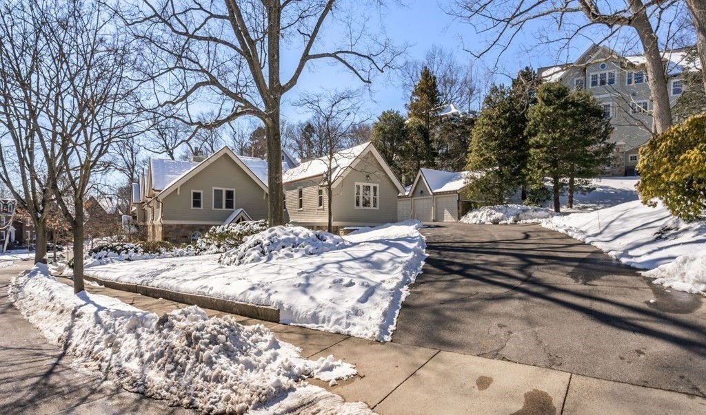 49 Rawson Road, Unit 49 Brookline, MA 02445 - Photo 35 of 42 a front view of a house with a yard
