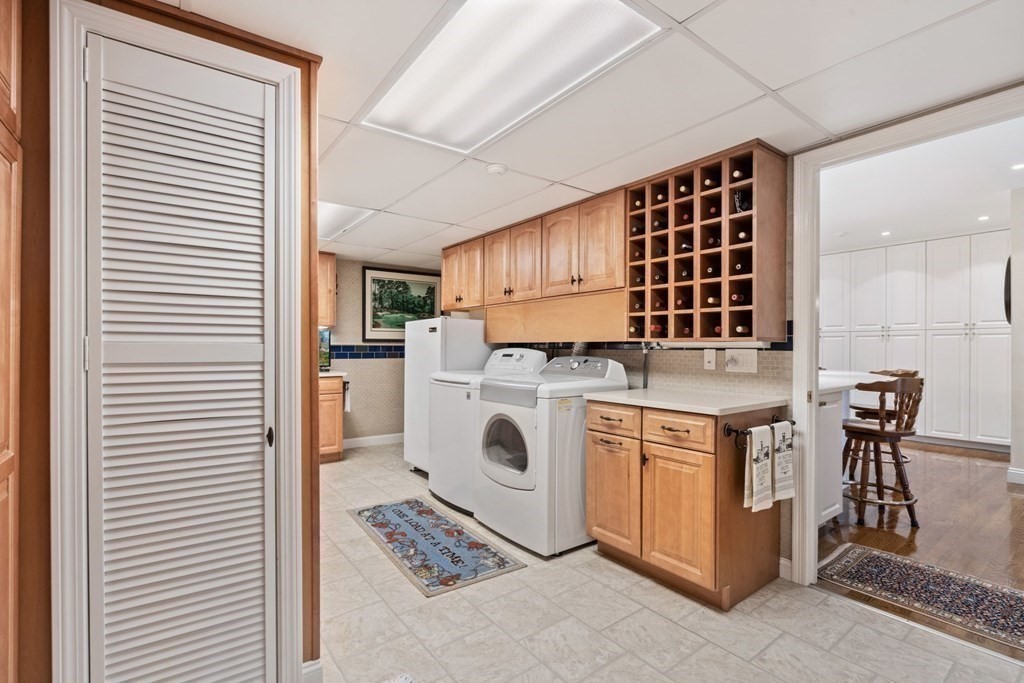49 Rawson Road, Unit 49 Brookline, MA 02445 - Photo 37 of 42 a kitchen with stainless steel appliances granite countertop a stove and a white cabinets