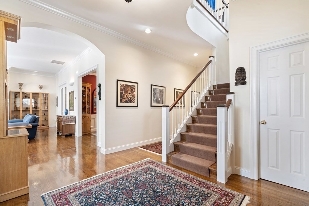 49 Rawson Road, Unit 49 Brookline, MA 02445 - Photo 4 of 42 a view of entryway and hall with wooden floor