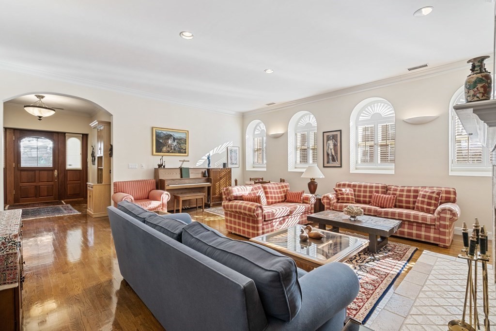 49 Rawson Road, Unit 49 Brookline, MA 02445 - Photo 7 of 42 a living room with furniture and a fireplace