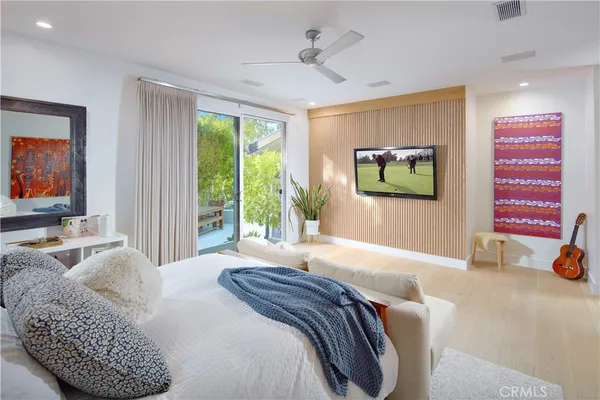 a bedroom with a bed and a couch