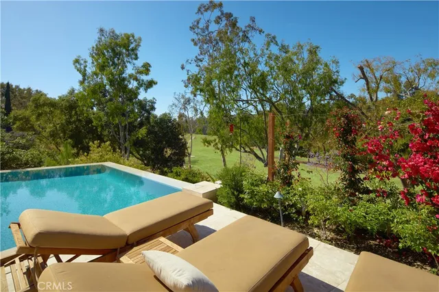 a view of a yard with an outdoor seating