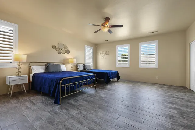 a bedroom with a bed and window