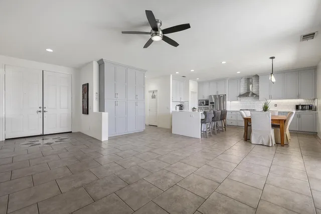 a view of kitchen with furniture and stainless steel appliances