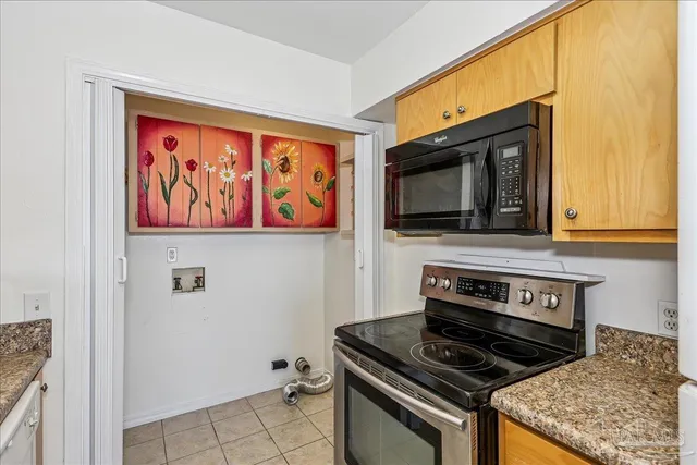 a kitchen with a stove and a microwave