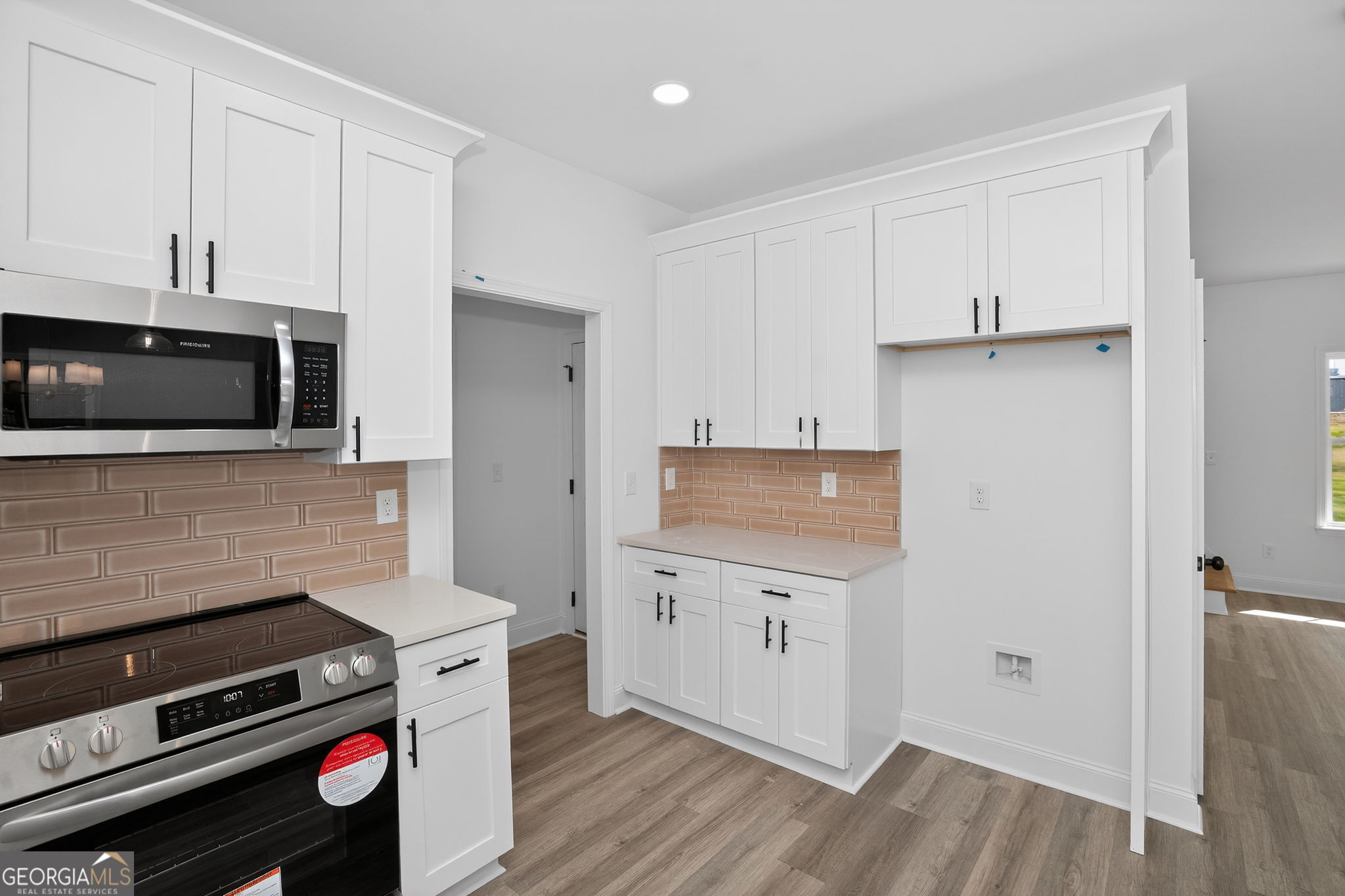 1229 Chappell Mill Road Jackson, GA 30233 - Photo 26 of 55 a kitchen with a stove and a microwave
