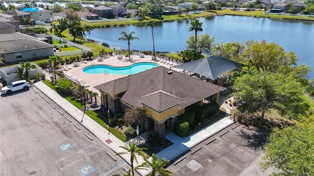 an aerial view of a house with a lake view