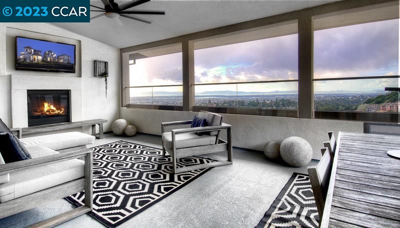 a bedroom with furniture and a large window