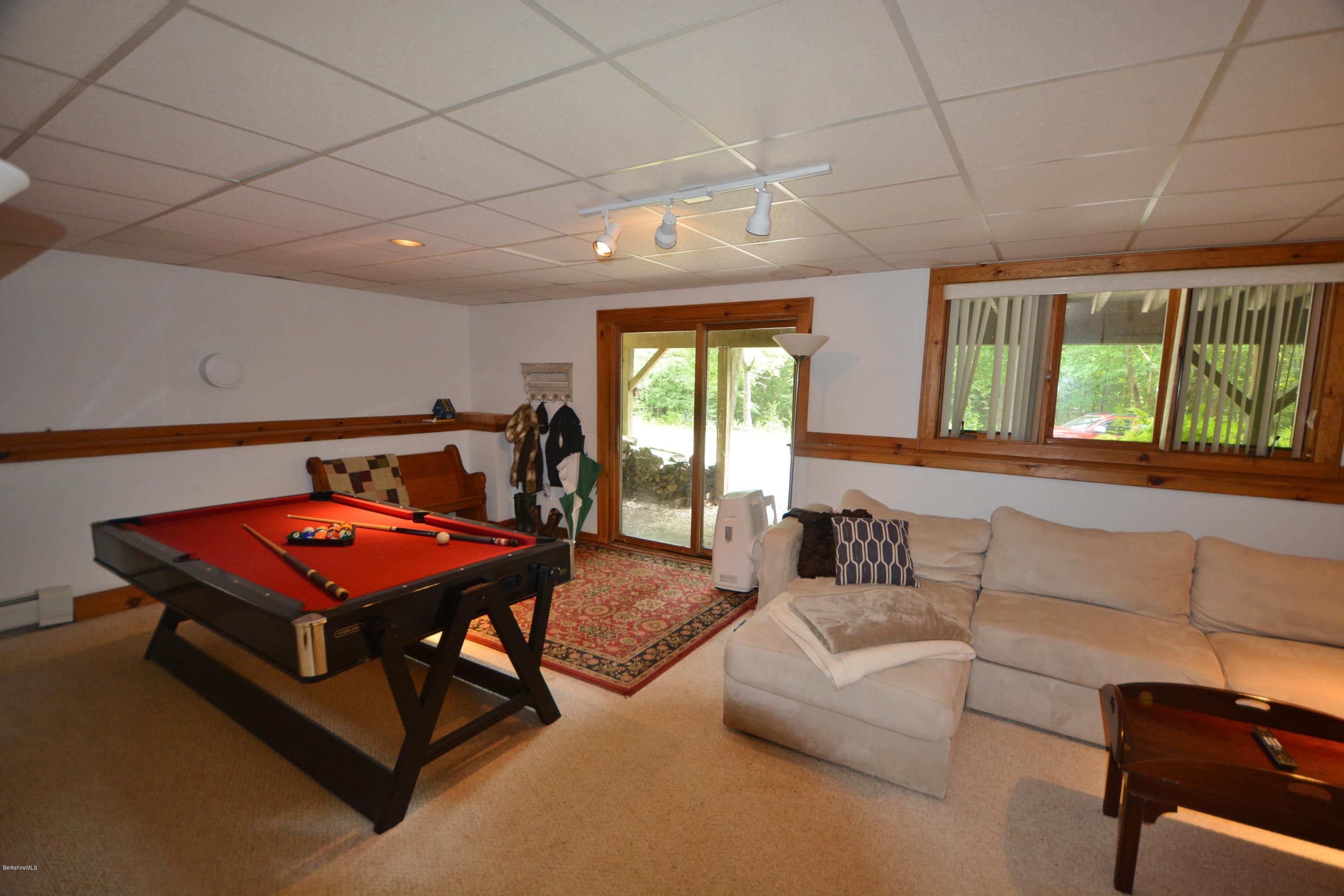 70 Rainbow Road Otis, MA 01029 - Photo 12 of 18 a living room with furniture a pool table and a large window