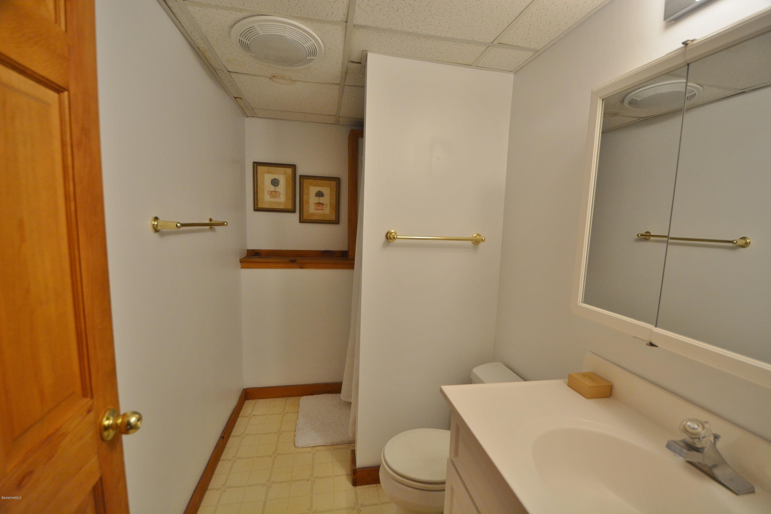 70 Rainbow Road Otis, MA 01029 - Photo 15 of 18 a bathroom with a sink and toilet