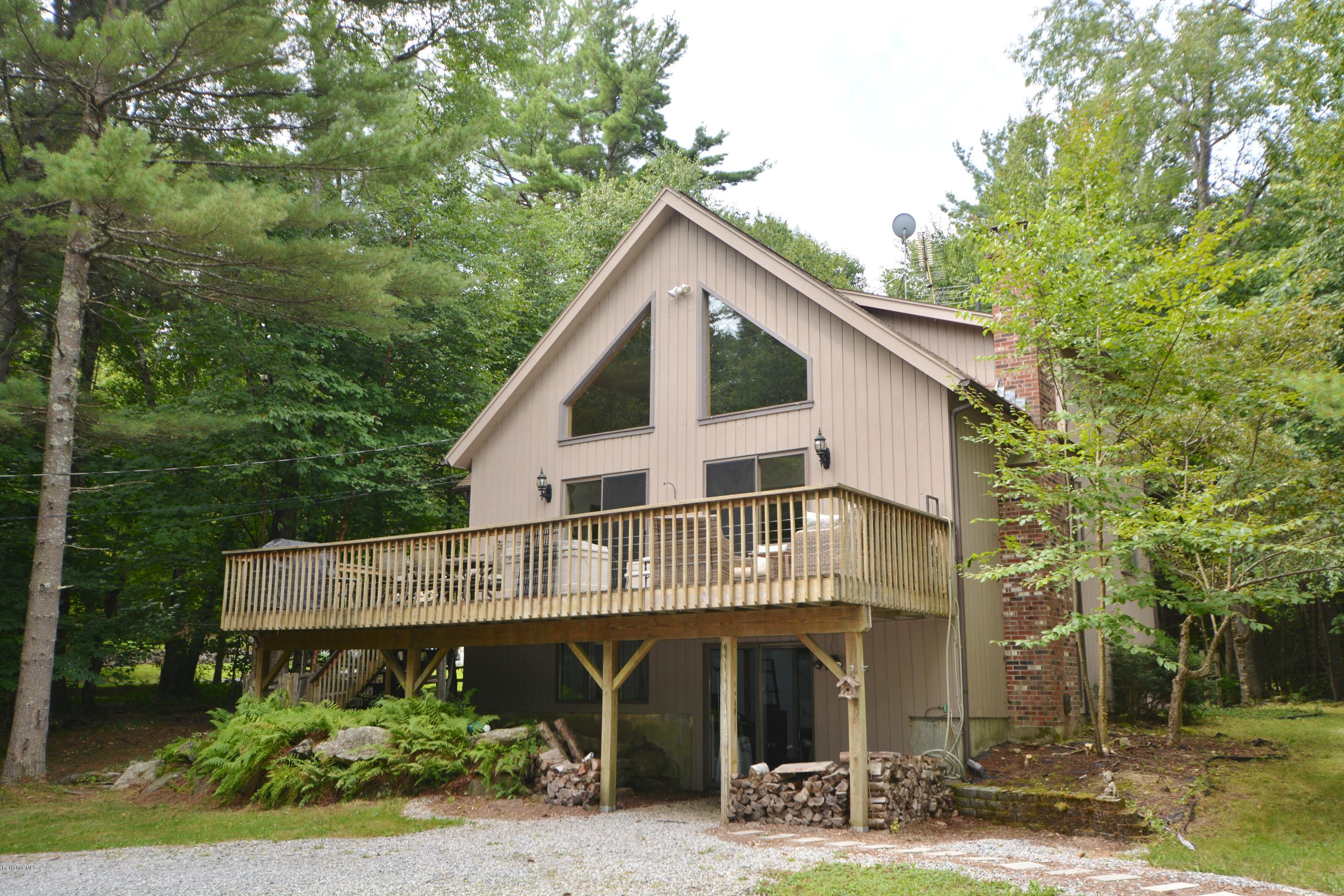 70 Rainbow Road Otis, MA 01029 - Photo 16 of 18 a front view of a house with garden