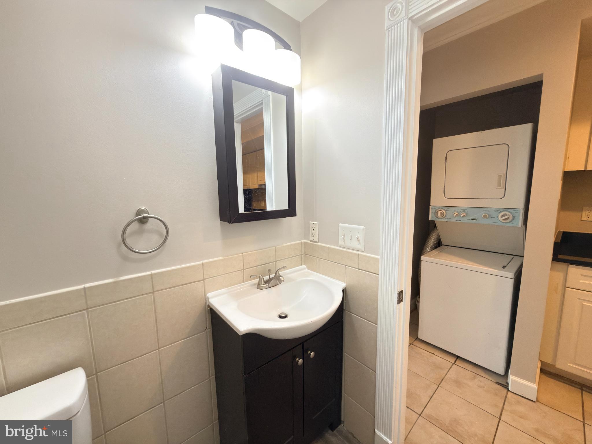 1246 Queen Street Northeast, Unit 2 Washington, DC 20002 - Photo 13 of 23 a bathroom with a sink and mirror