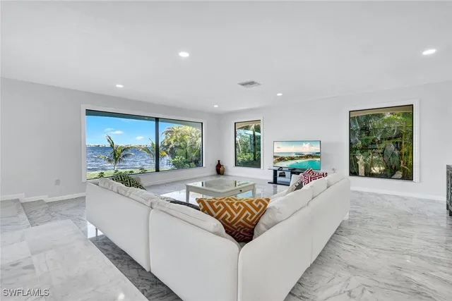 a living room with furniture and a table