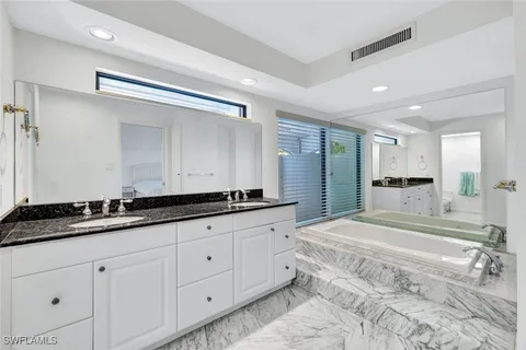 a bedroom with a bed and a cabinets