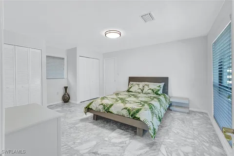 a bathroom with a sink vanity and a mirror