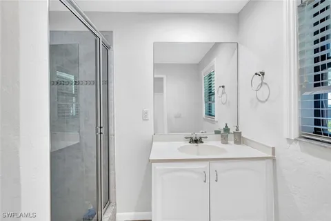 a room with gym equipment and a large window