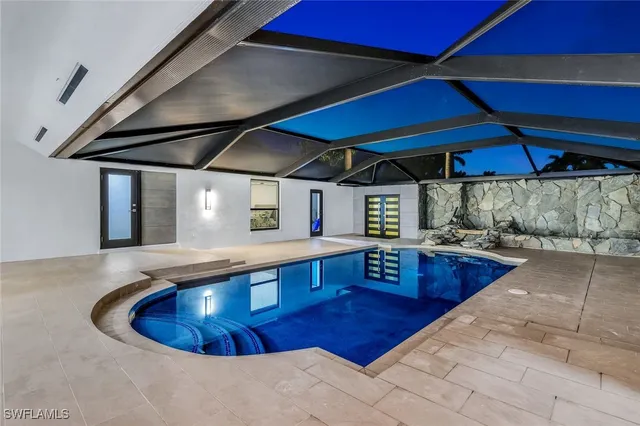 a kitchen with stainless steel appliances granite countertop a sink dishwasher stove and cabinets