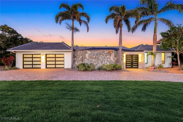 a view of a room with wooden floor and windows