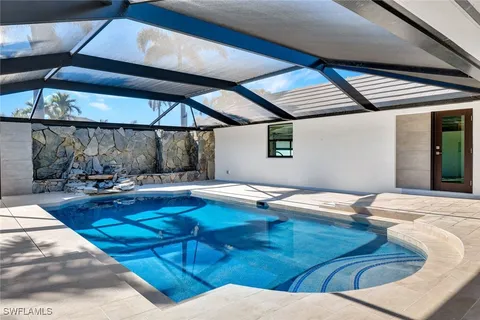 a outdoor space with lots of white furniture