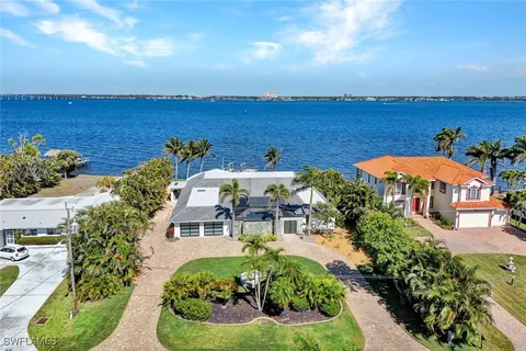 an aerial view of a house with a swimming pool