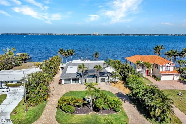 an aerial view of a house with a swimming pool