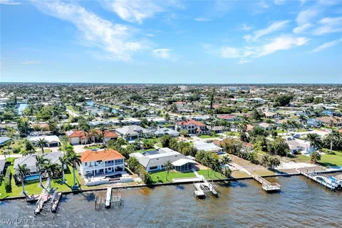 a view of a swimming pool with a lounge chairs