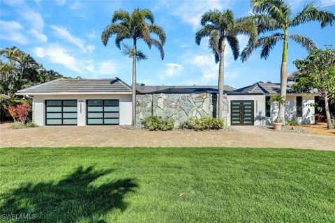an aerial view of a house with a swimming pool