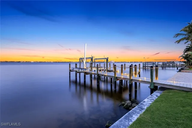 a kitchen with cabinets and chairs
