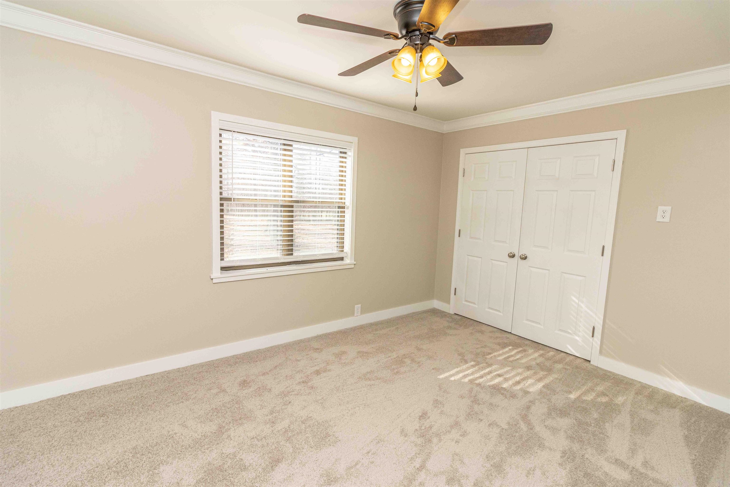 8453 Highway 45 Ramer, TN 38367 - Photo 25 of 40 an empty room with windows and fan
