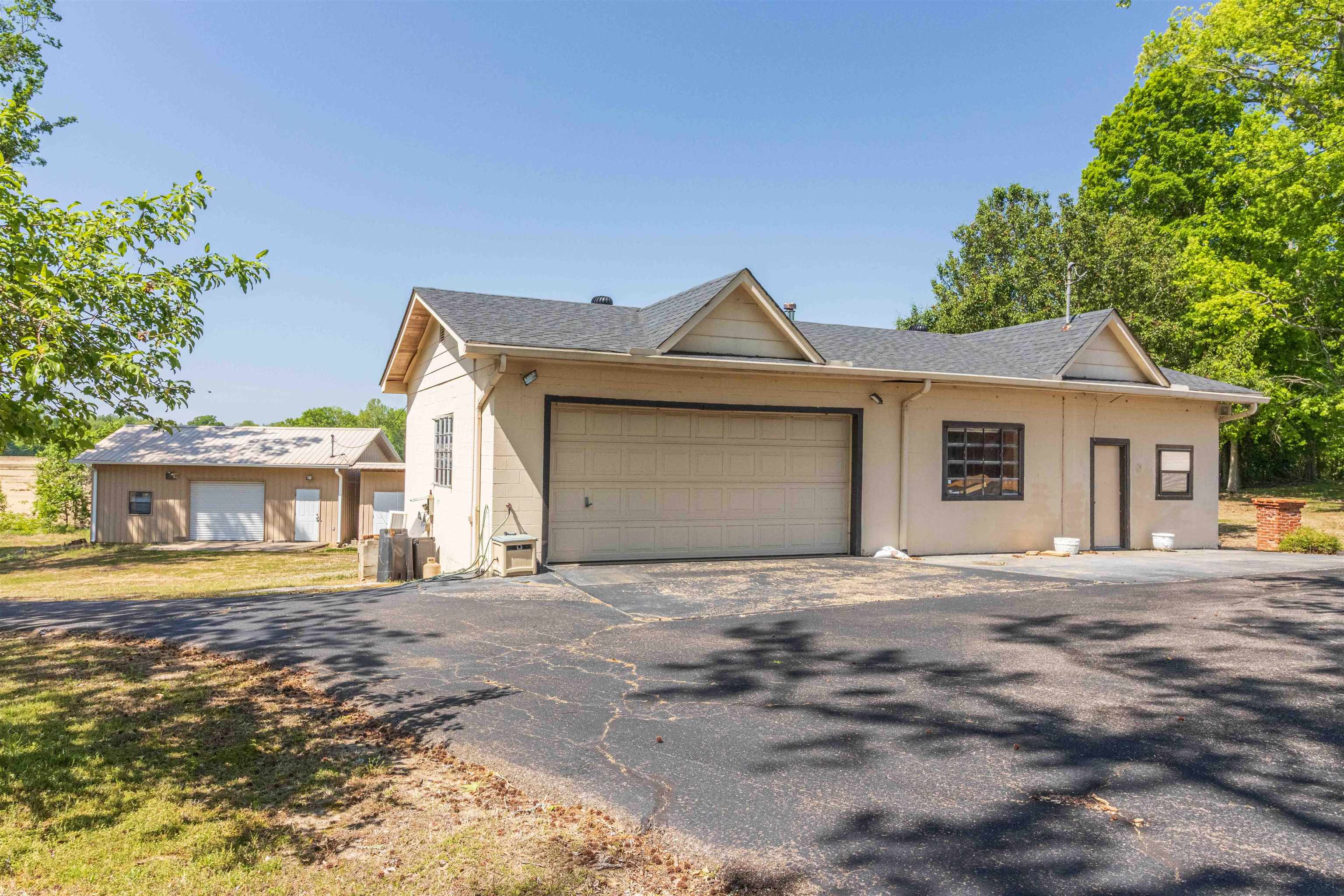 8453 Highway 45 Ramer, TN 38367 - Photo 35 of 40 a front view of a house with a garden and yard