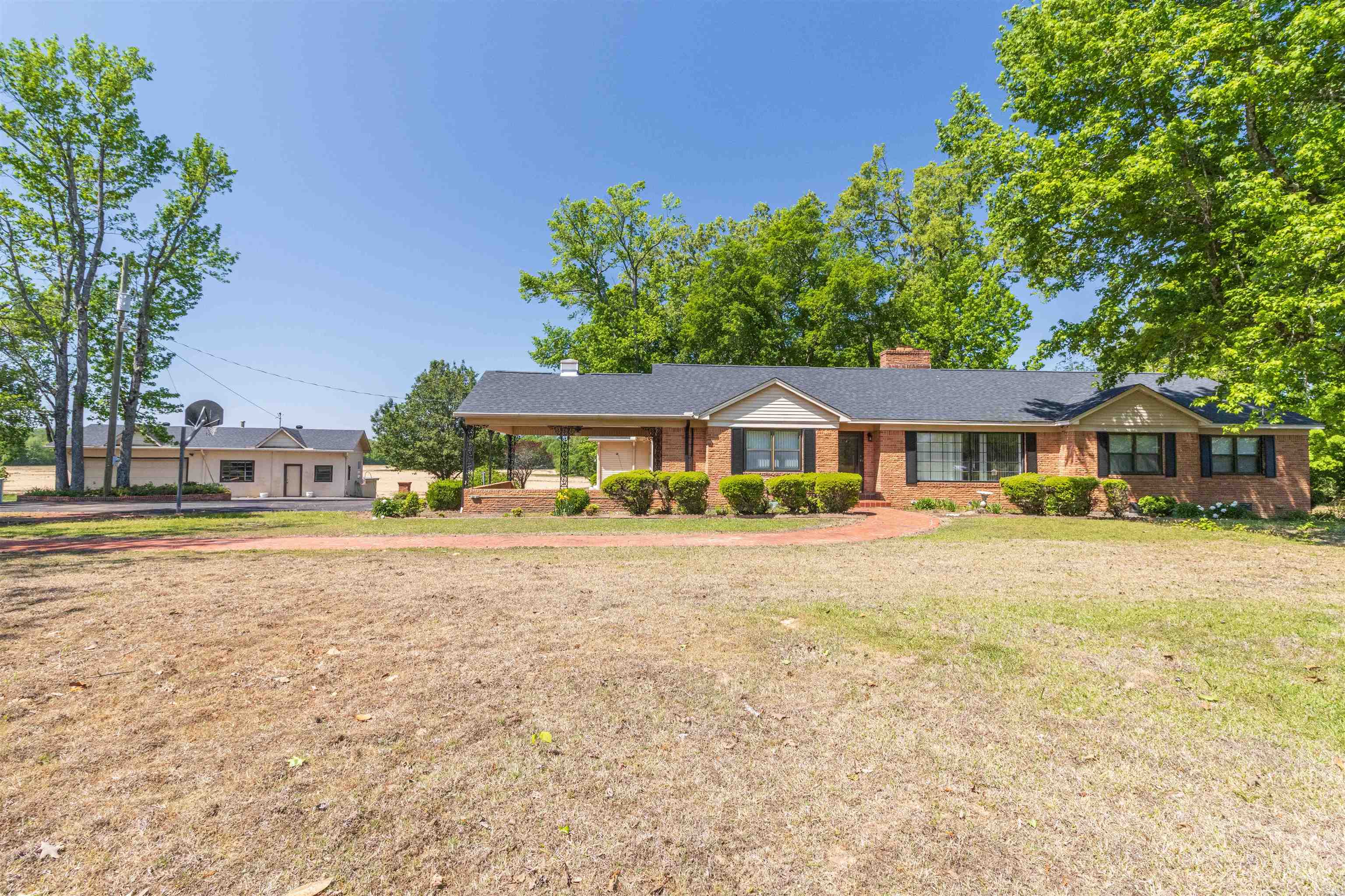 8453 Highway 45 Ramer, TN 38367 - Photo 4 of 40 a front view of a house with a garden