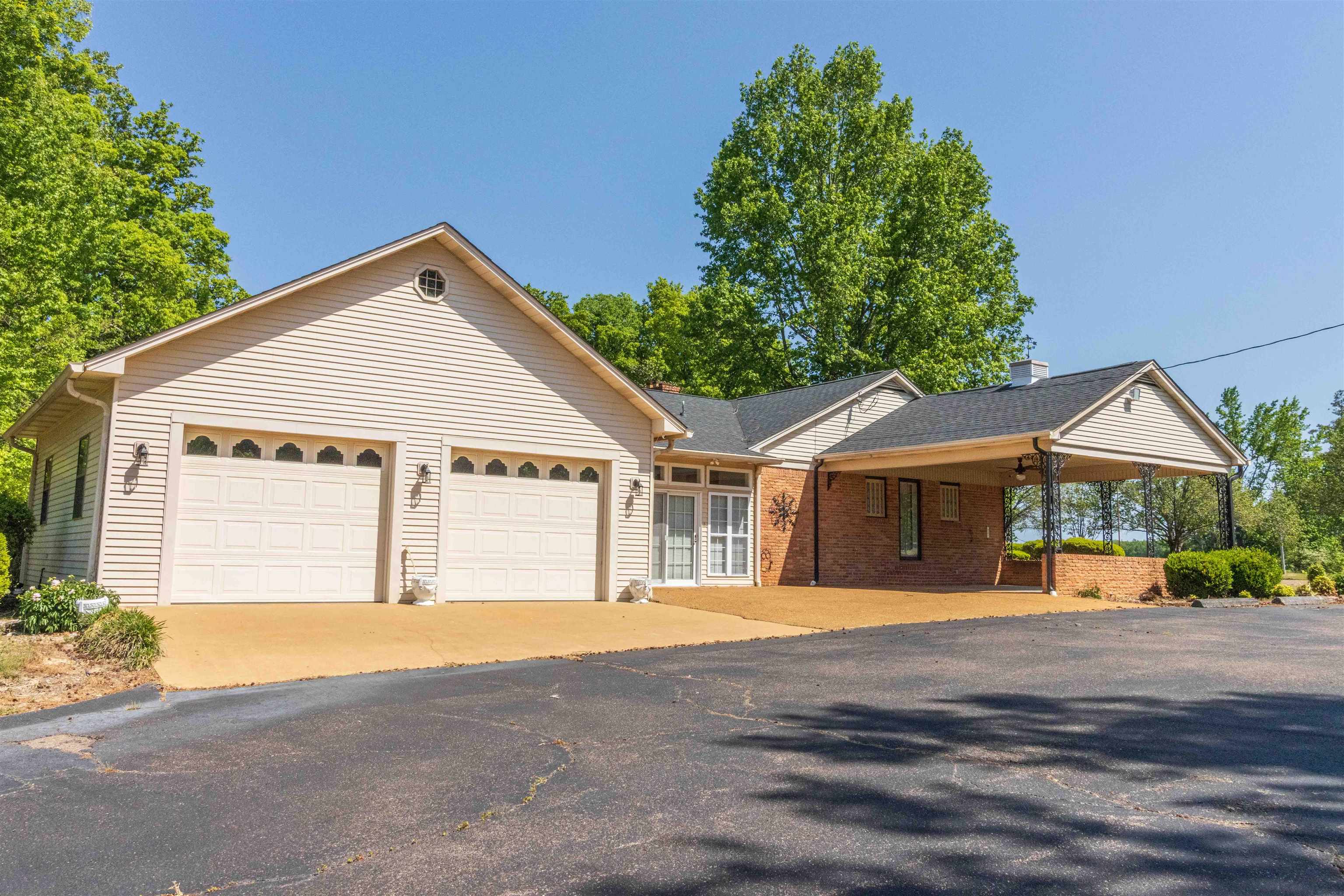 8453 Highway 45 Ramer, TN 38367 - Photo 5 of 40 a front view of a house with a garden