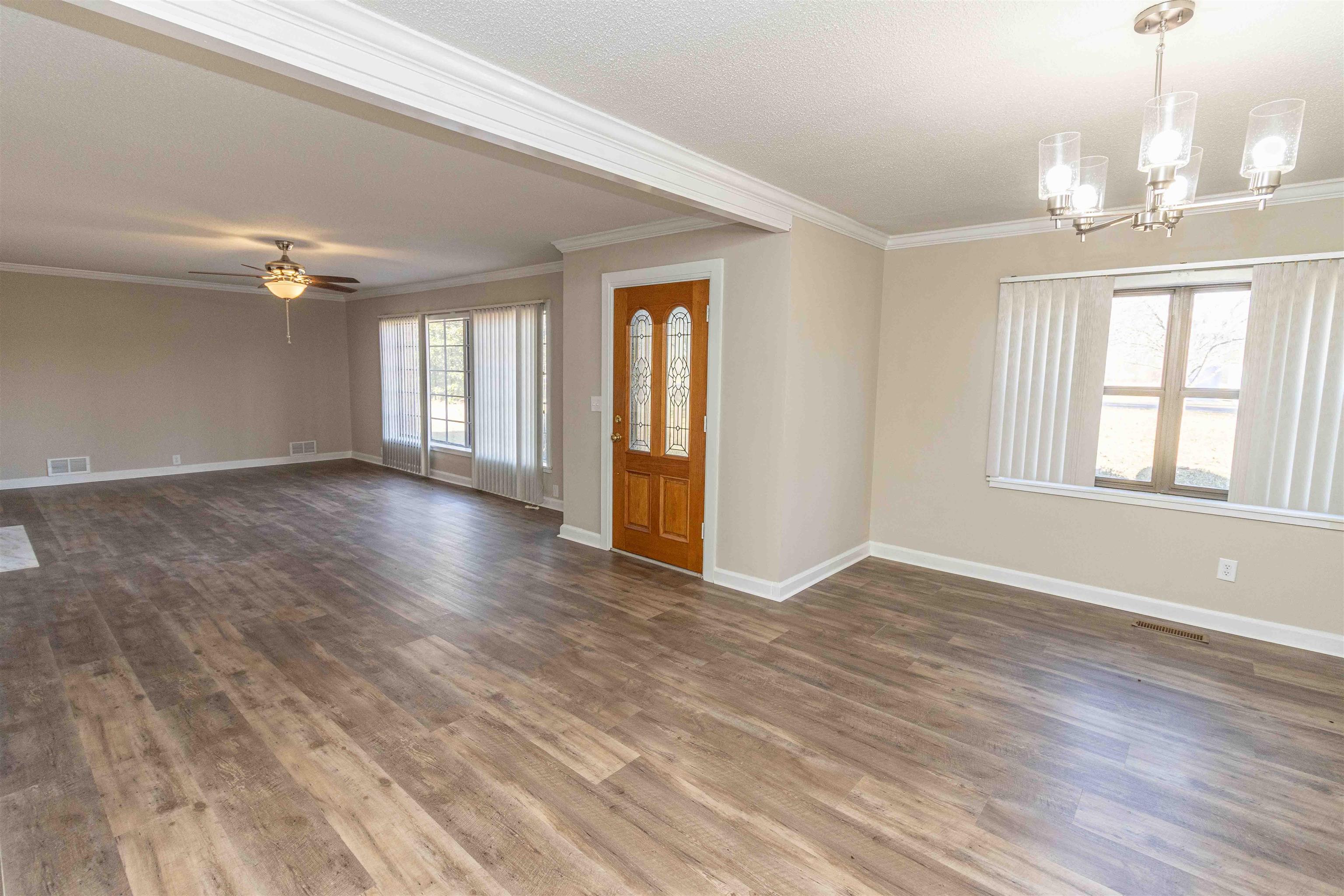 8453 Highway 45 Ramer, TN 38367 - Photo 8 of 40 a view of an empty room with wooden floor and a window