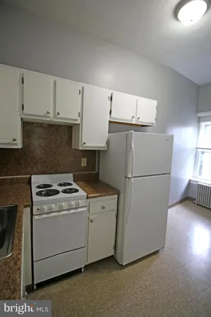 a bathroom with a tub and a window