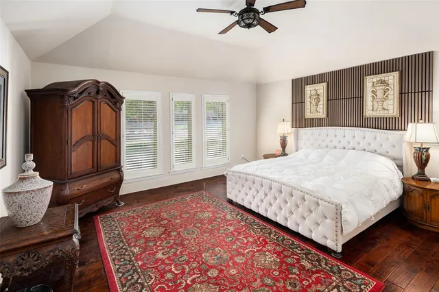 a bedroom with a bed and cabinets