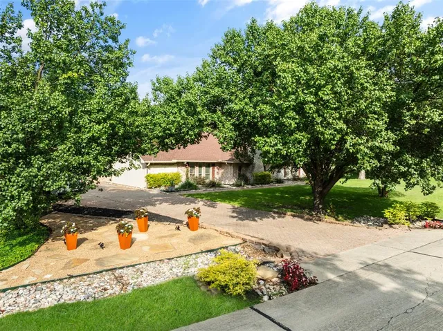 a view of backyard with swimming pool