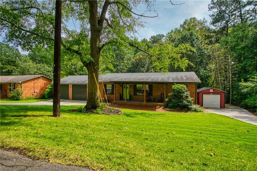 3917 Buck Road Powder Springs, GA 30127 - Photo 1 of 1 front view of a house with a yard