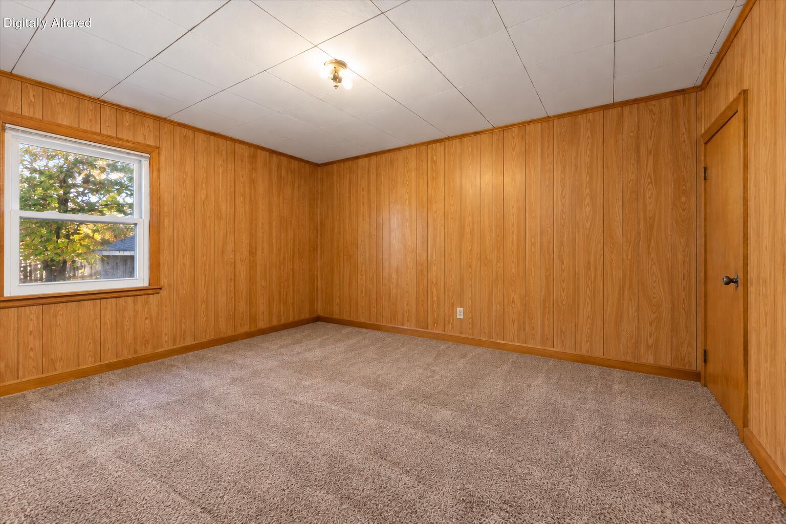 2063 Mt Pleasant Street Racine, WI 53404 - Photo 14 of 24 Empty Mid-Century Wood-Paneled Room