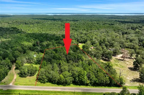 a view of a field with an outdoor space