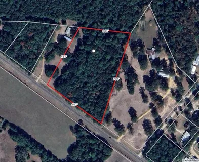 a view of a yard with an outdoor seating