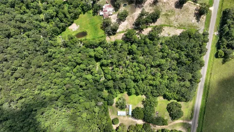 a view of a house with a tree