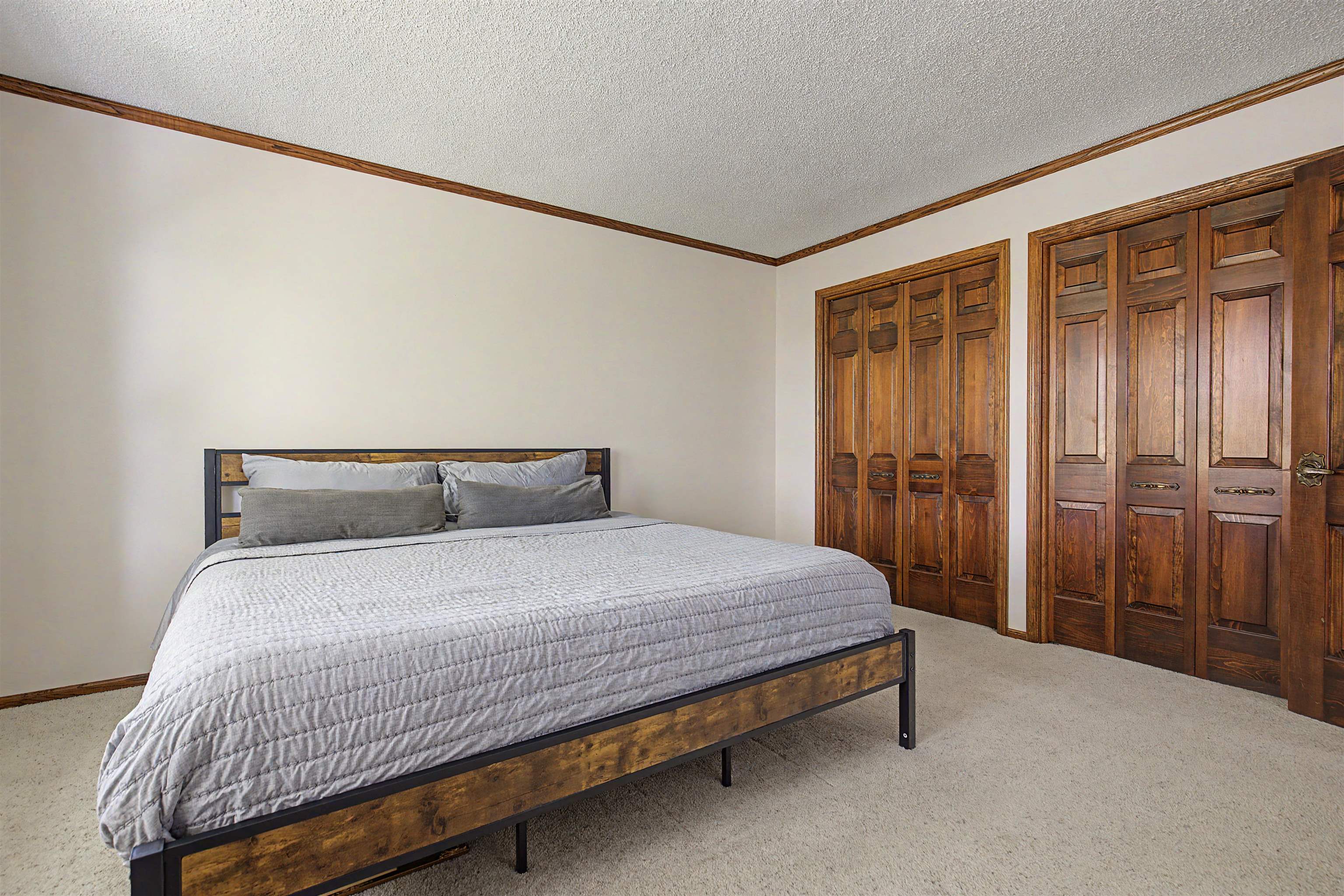 17380 Corbett Road Mount Carroll, IL 61053 - Photo 18 of 65 a bedroom with a bed and wooden floor