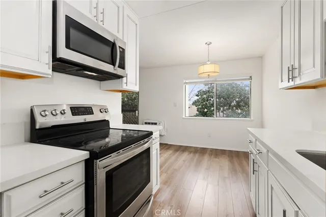 a kitchen with a stove and a microwave