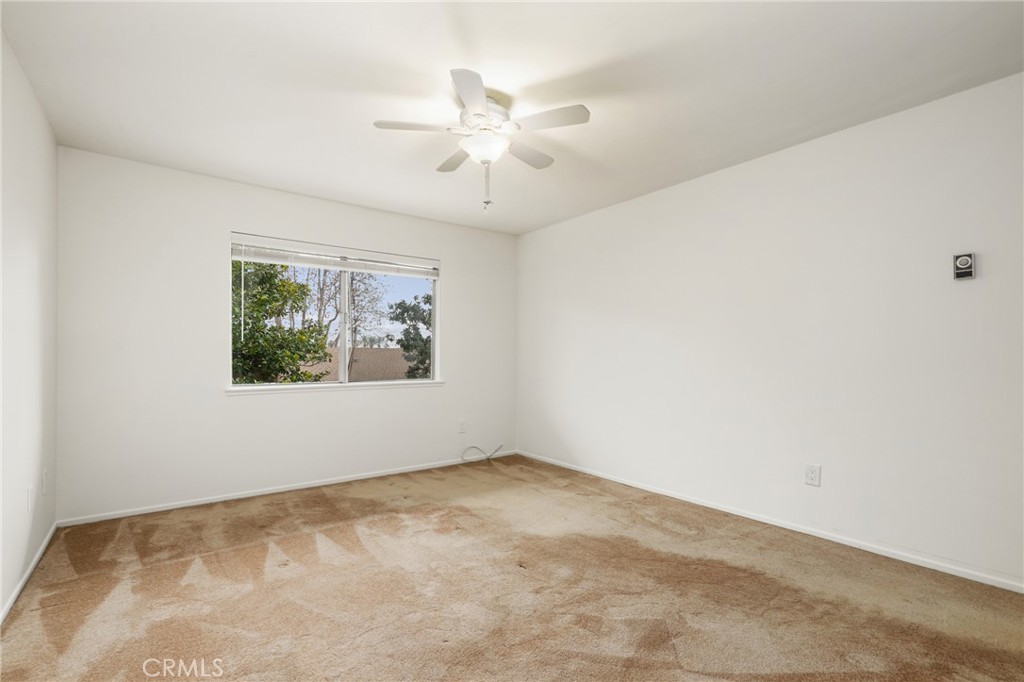 12200 Montecito Road, Unit D301 Seal Beach, CA 90740 - Photo 18 of 32 an empty room with windows and fan